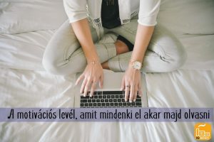 woman-sitting-on-bed-working-on-laptop
